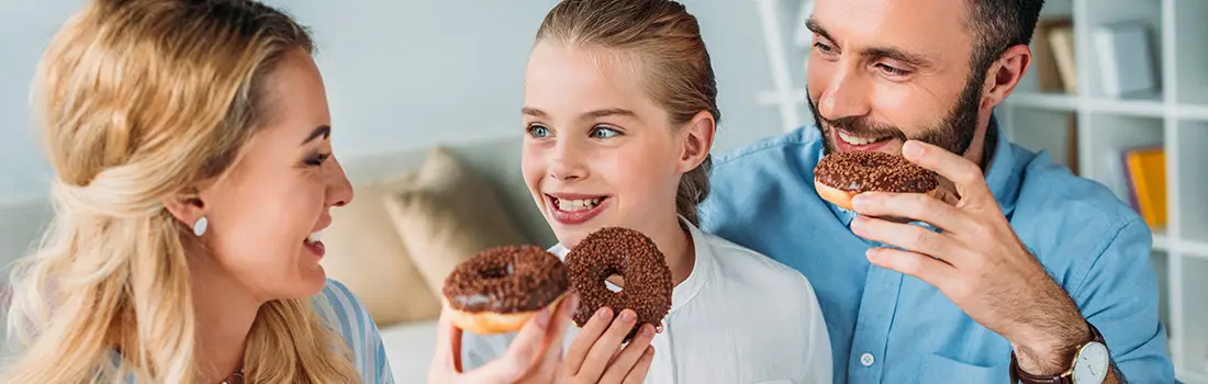 family enjoying donuts